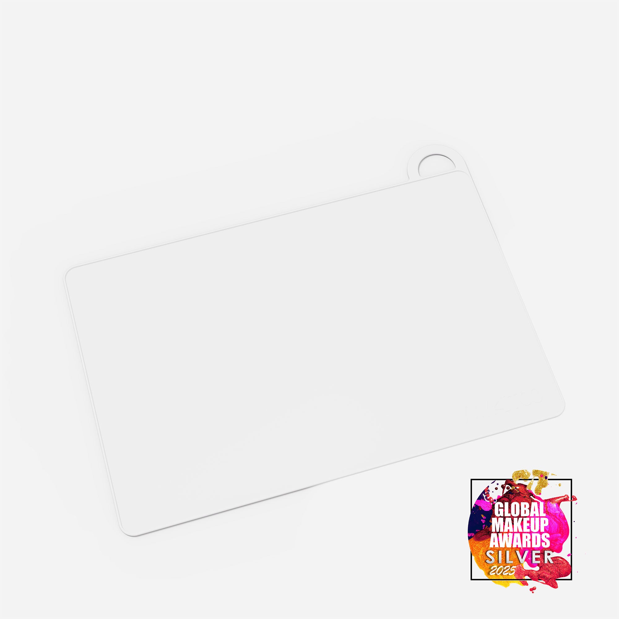 White MY BIG MAKEUP MAT from MYKITCO, a versatile makeup tools mat with award-winning design for easy makeup application.