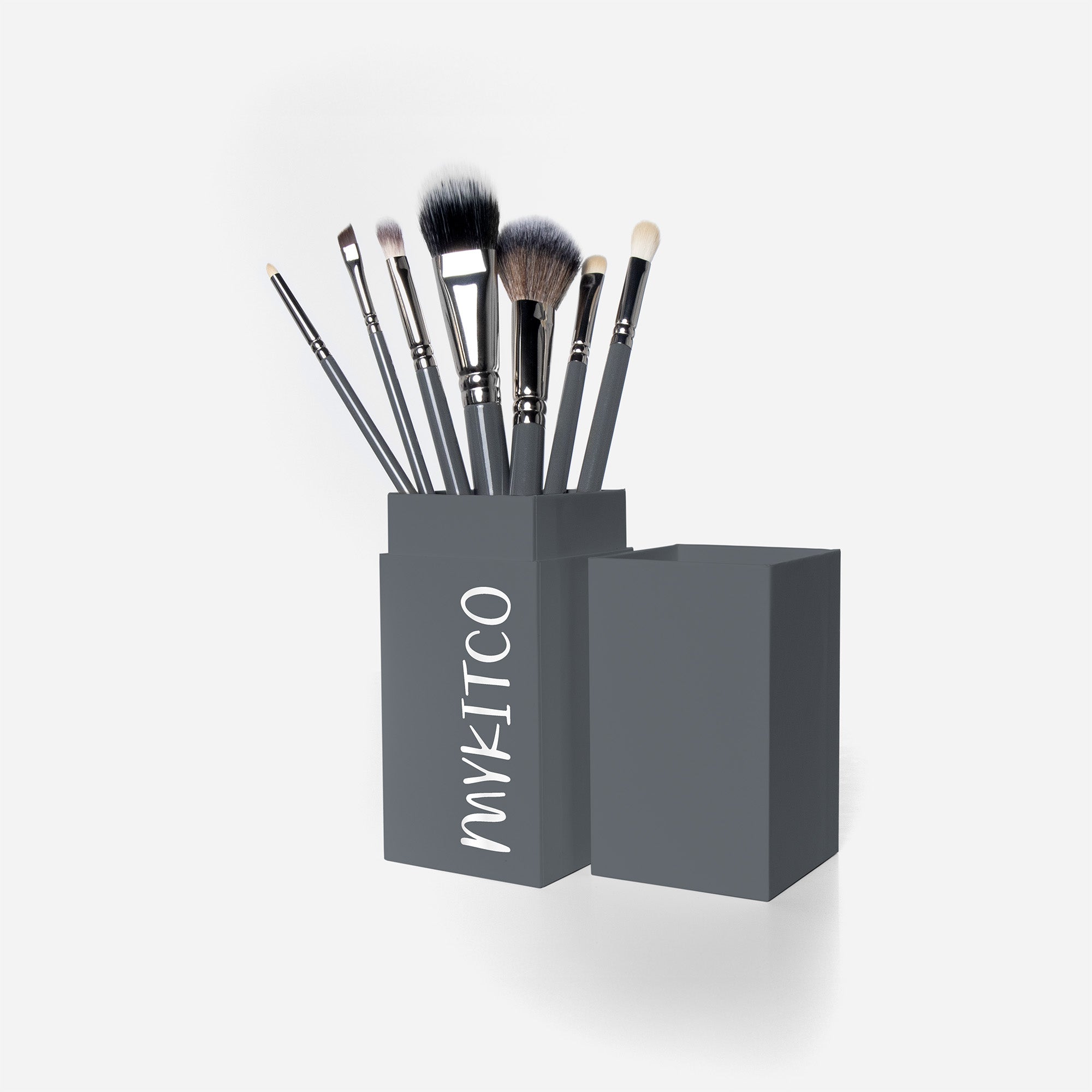 MYKITCO small essential brush set with various makeup brushes displayed on a clean surface.