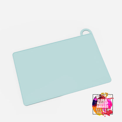 Blue MY BIG MAKEUP MAT by MYKITCO, a makeup tools mat with awards, shown in the image.