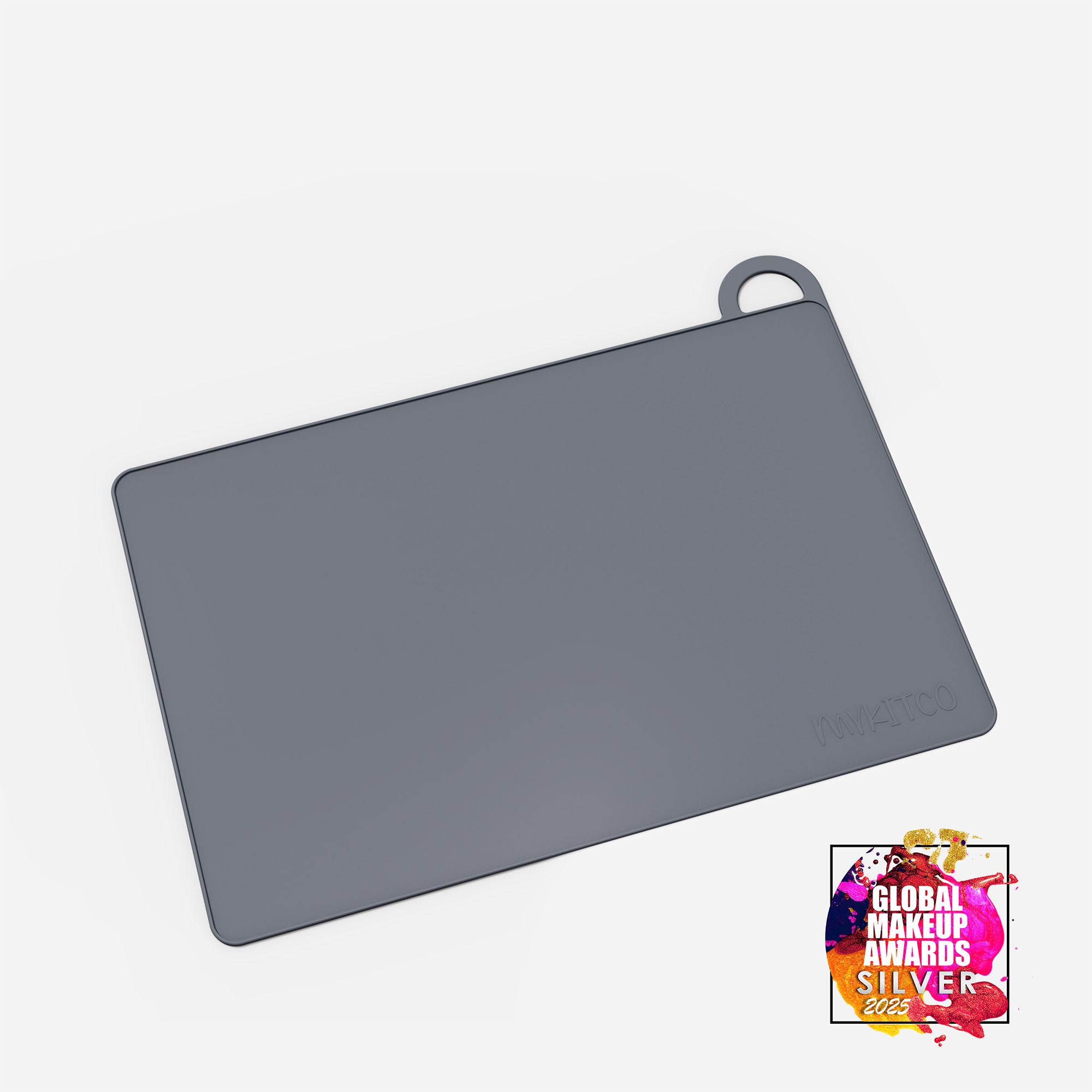 Gray MY BIG MAKEUP MAT from MYKITCO displayed on a clean surface, showcasing its soft, durable makeup tools mat design.